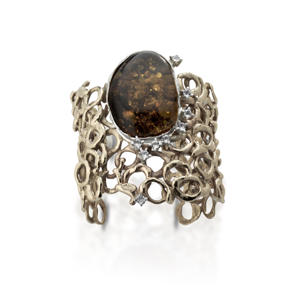 Silver, bronze bracelet with  amber  and white topazes